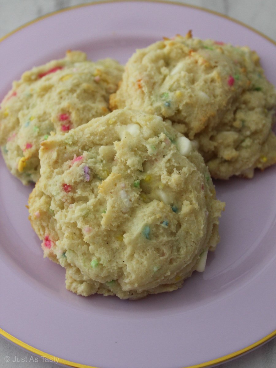 Funfetti sugar cookies on a purple plate.