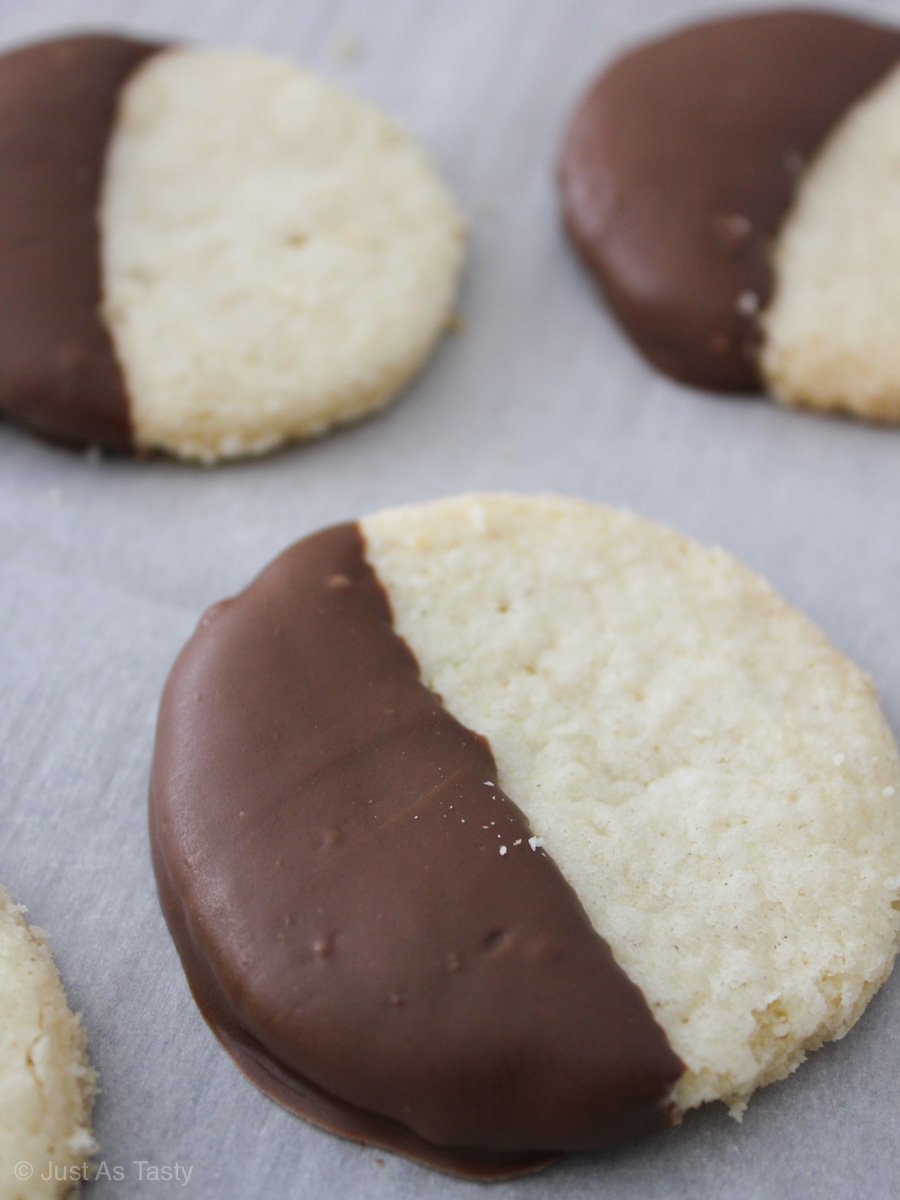 Round gluten free shortbread cookies dipped in chocolate.
