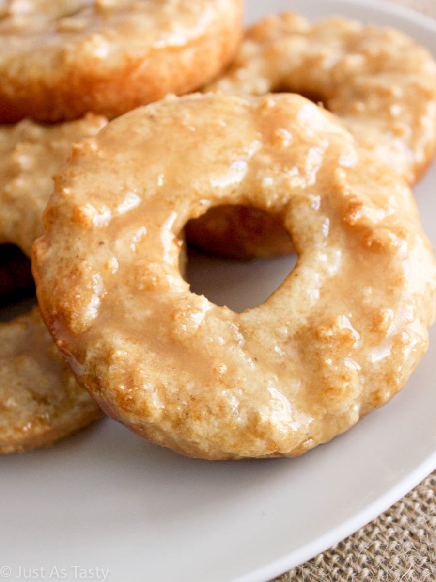 Close-up of a maple glazed donuts on a white plate.