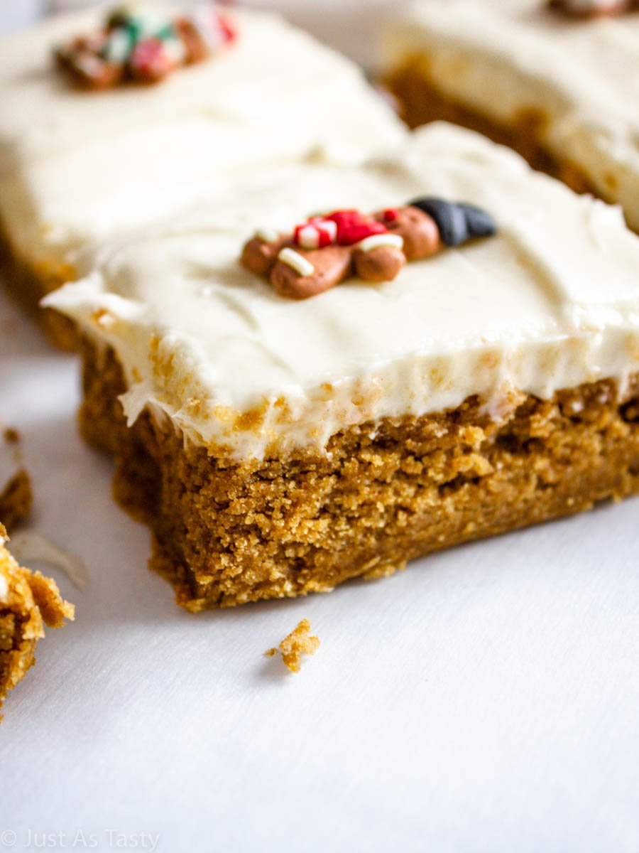 Close-up of gluten free gingerbread bars topped with cream cheese frosting.