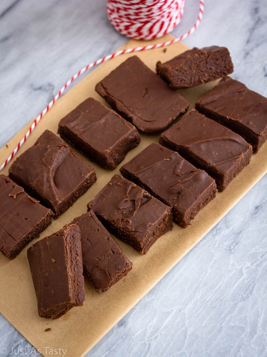 Homemade fudge slices on brown parchment paper. 