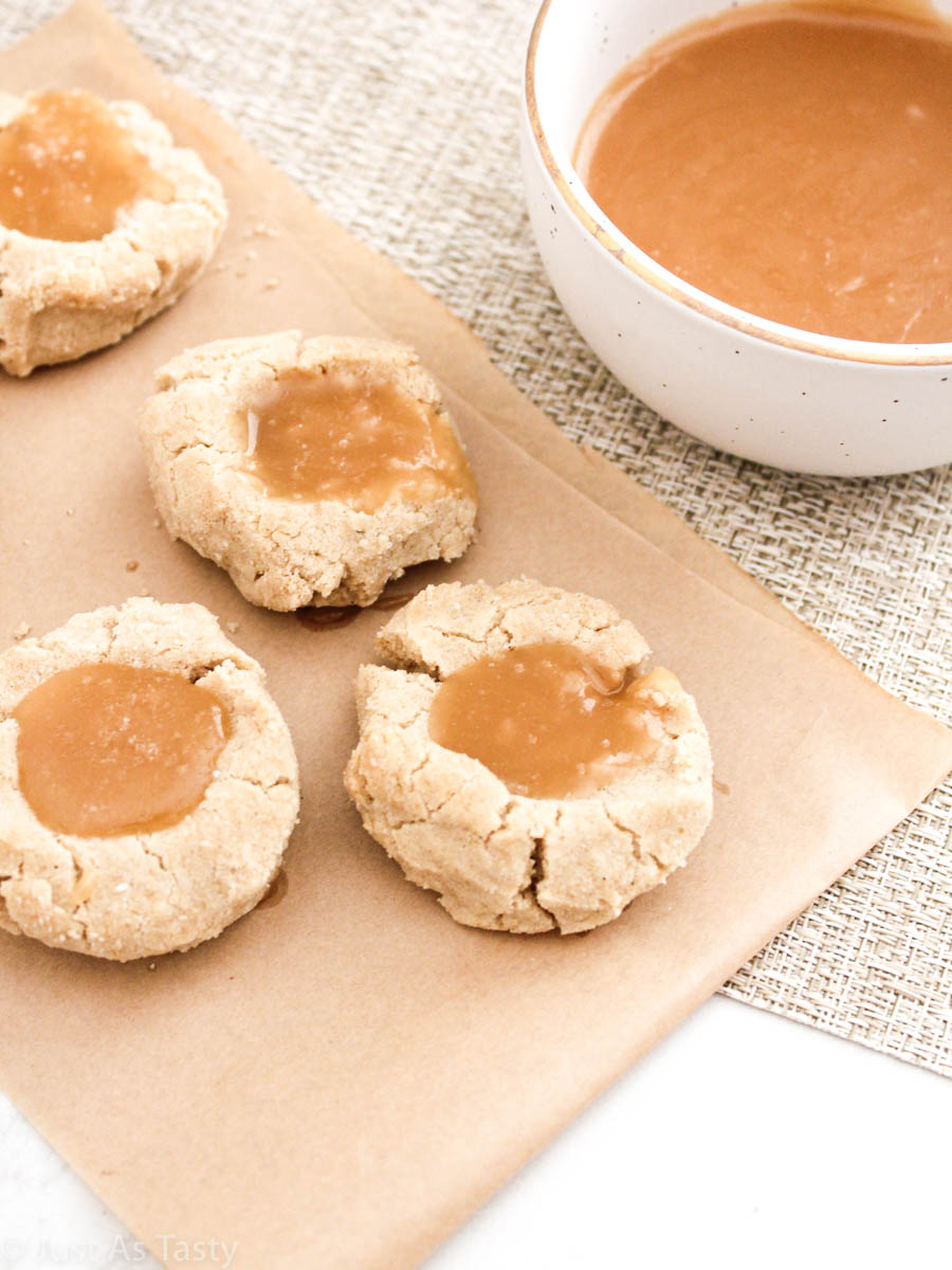 Salted caramel cookies on parchment paper.