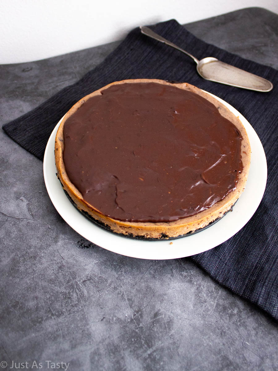 Gluten free chocolate cheesecake on a white plate.