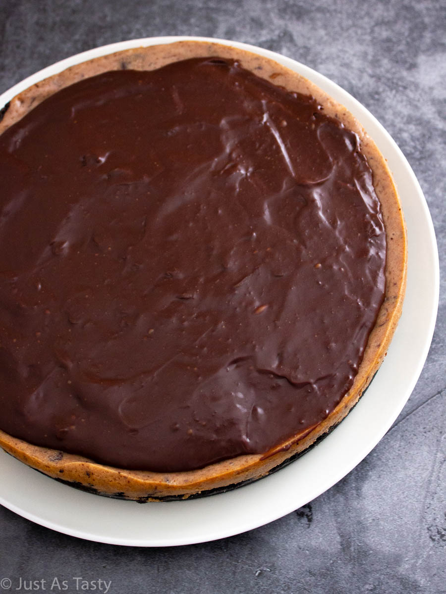 Gluten free chocolate cheesecake on a white plate.