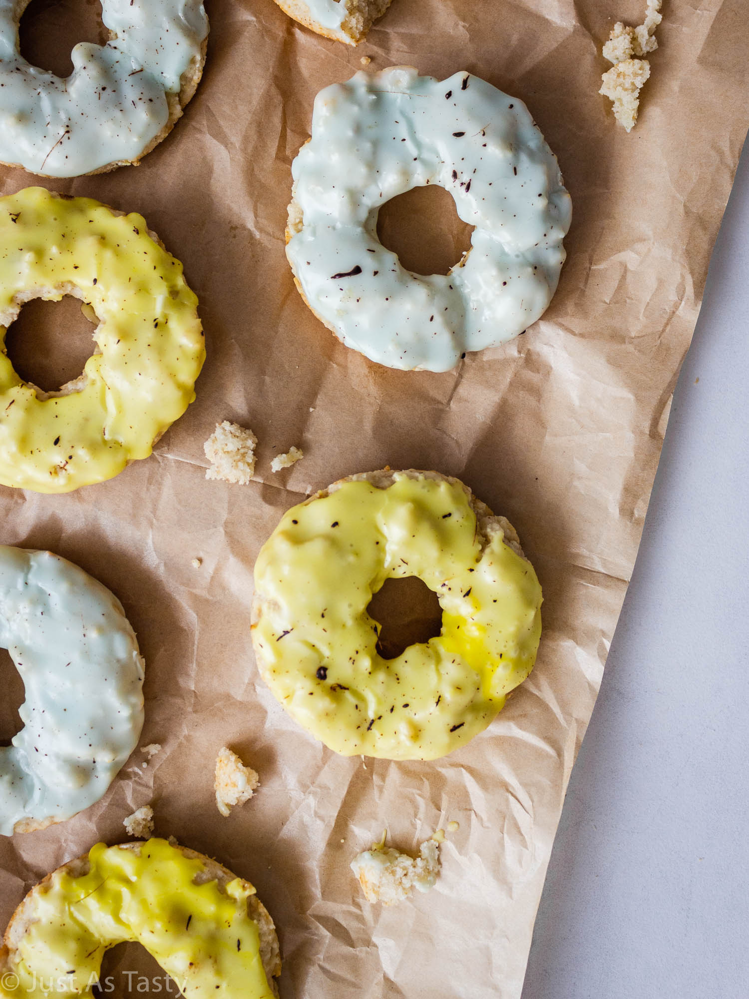 Baked banana donuts on brown parchment paper. 