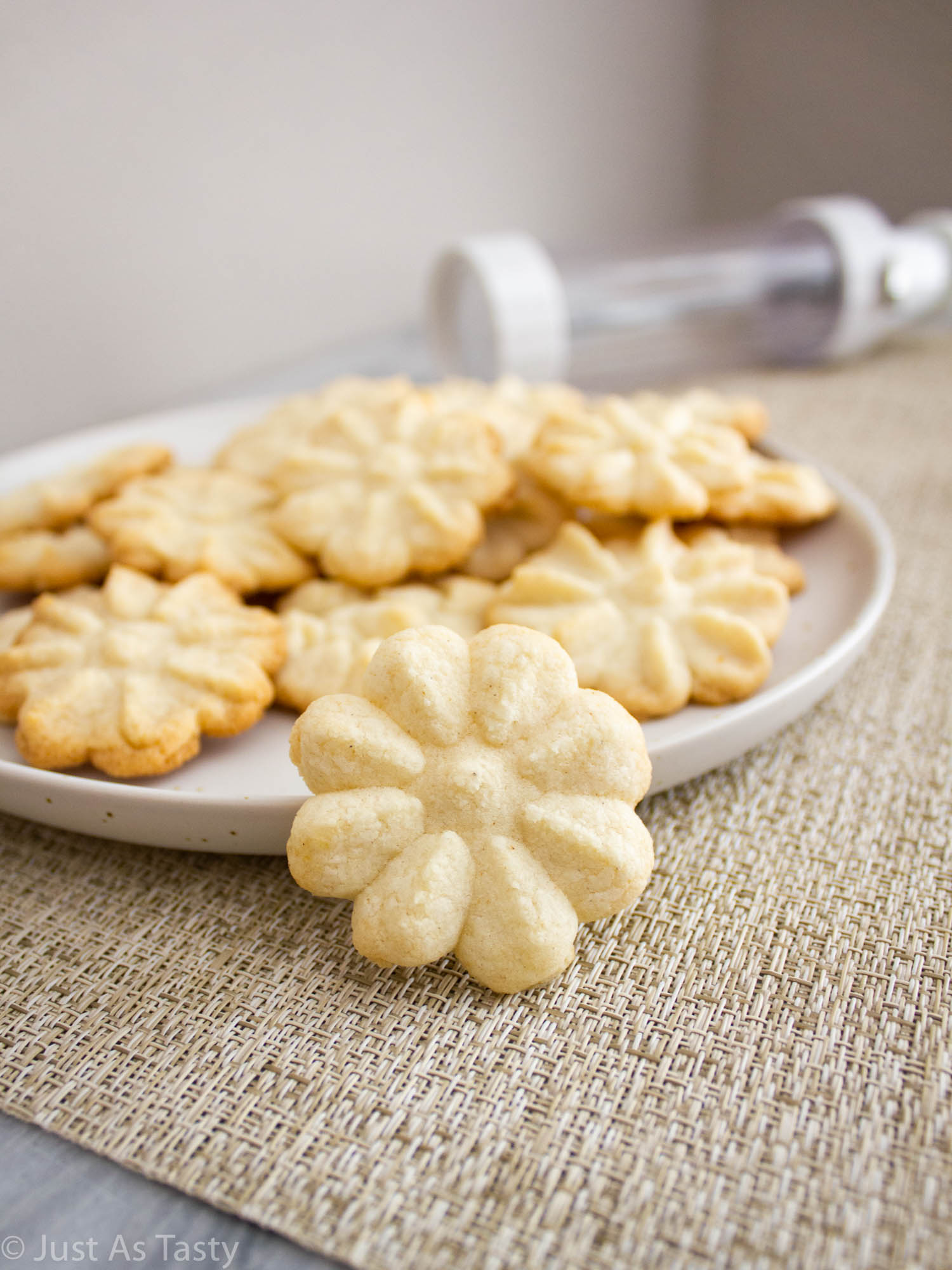 Close-up of a flower-shaped spritz butter cookie. 