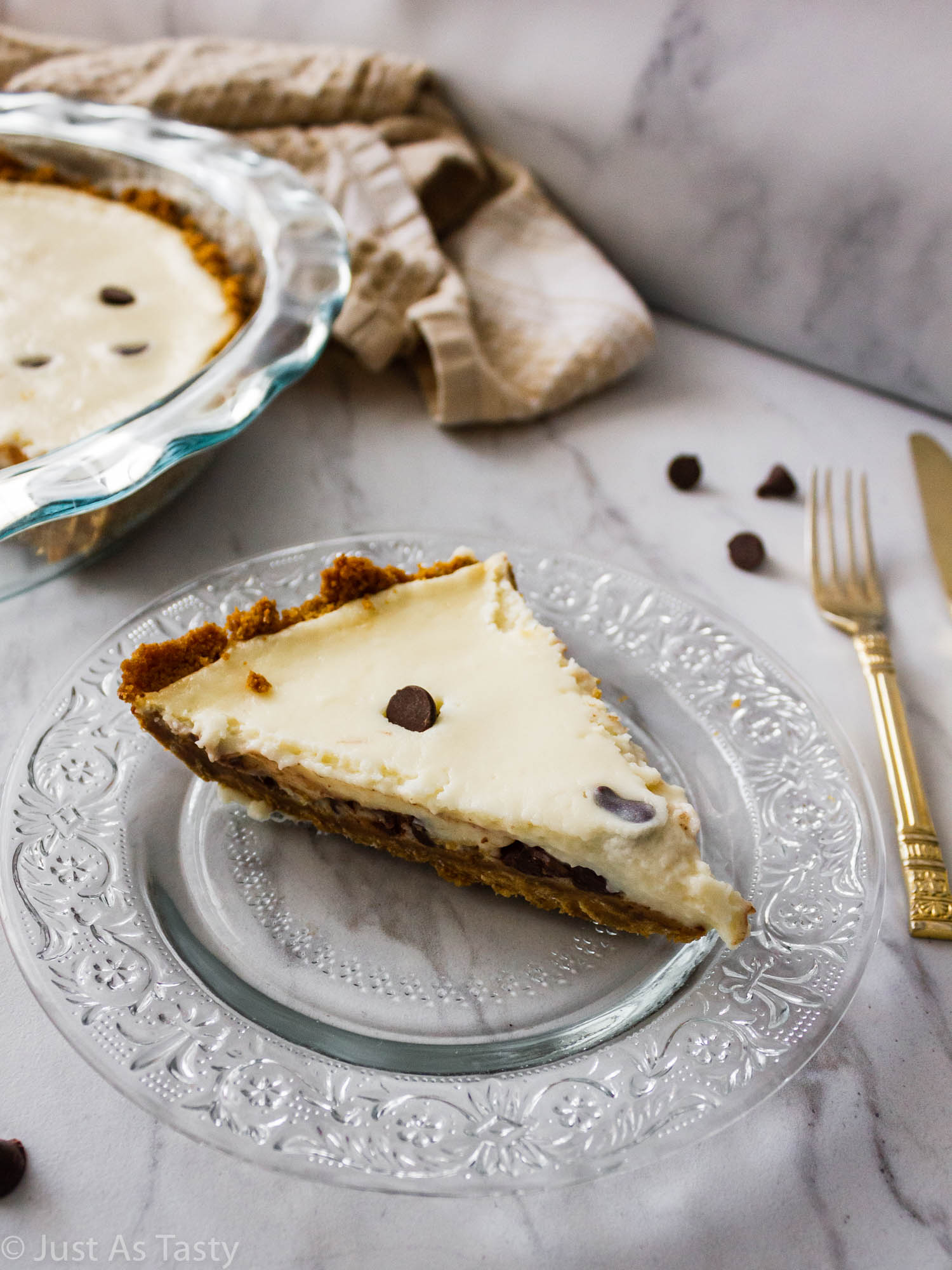 Slice of cannoli pie on a glass plate.