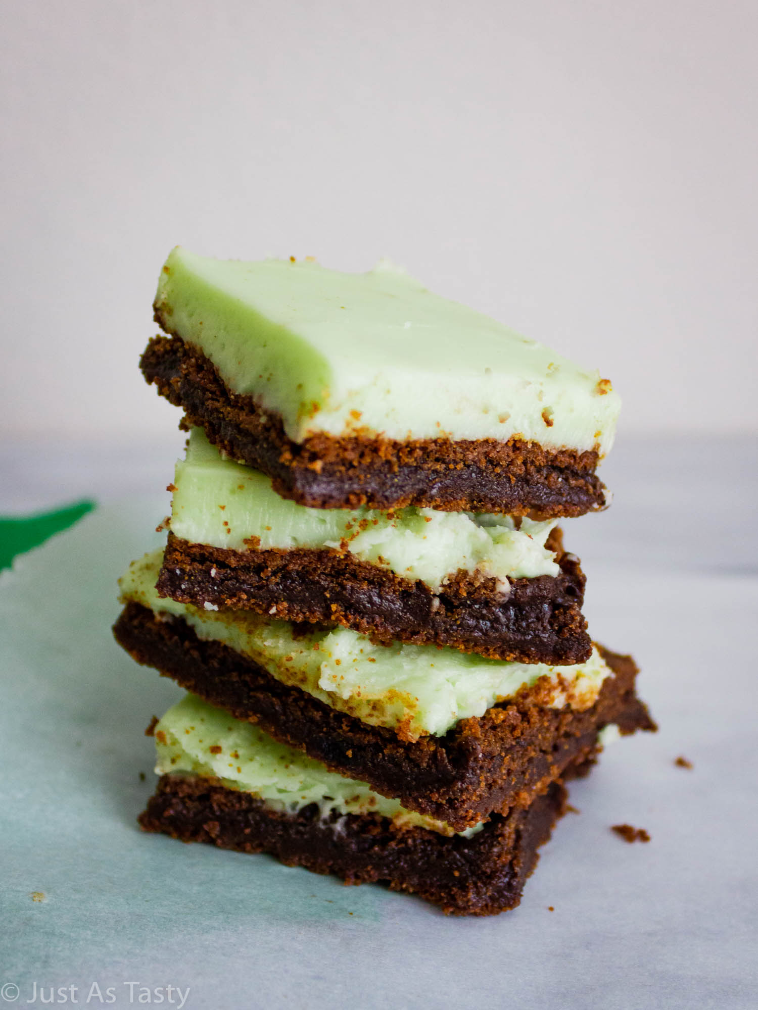 Stack of grasshopper bars on parchment paper. 