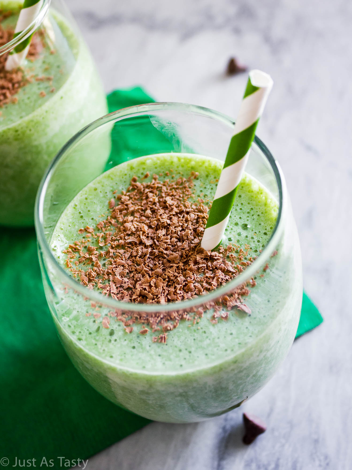 Close-up of a shamrock shake with a green straw.