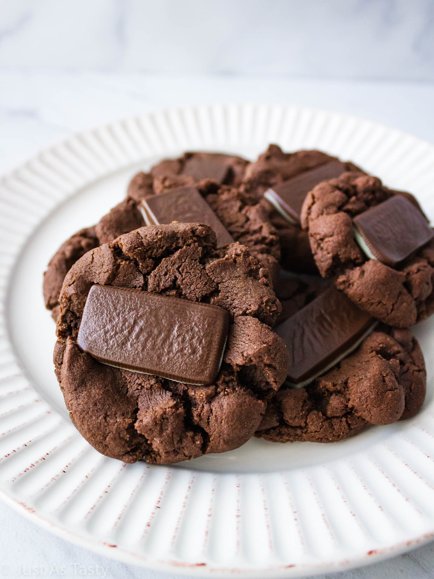 Andes mint chocolate cookies on a white plate.