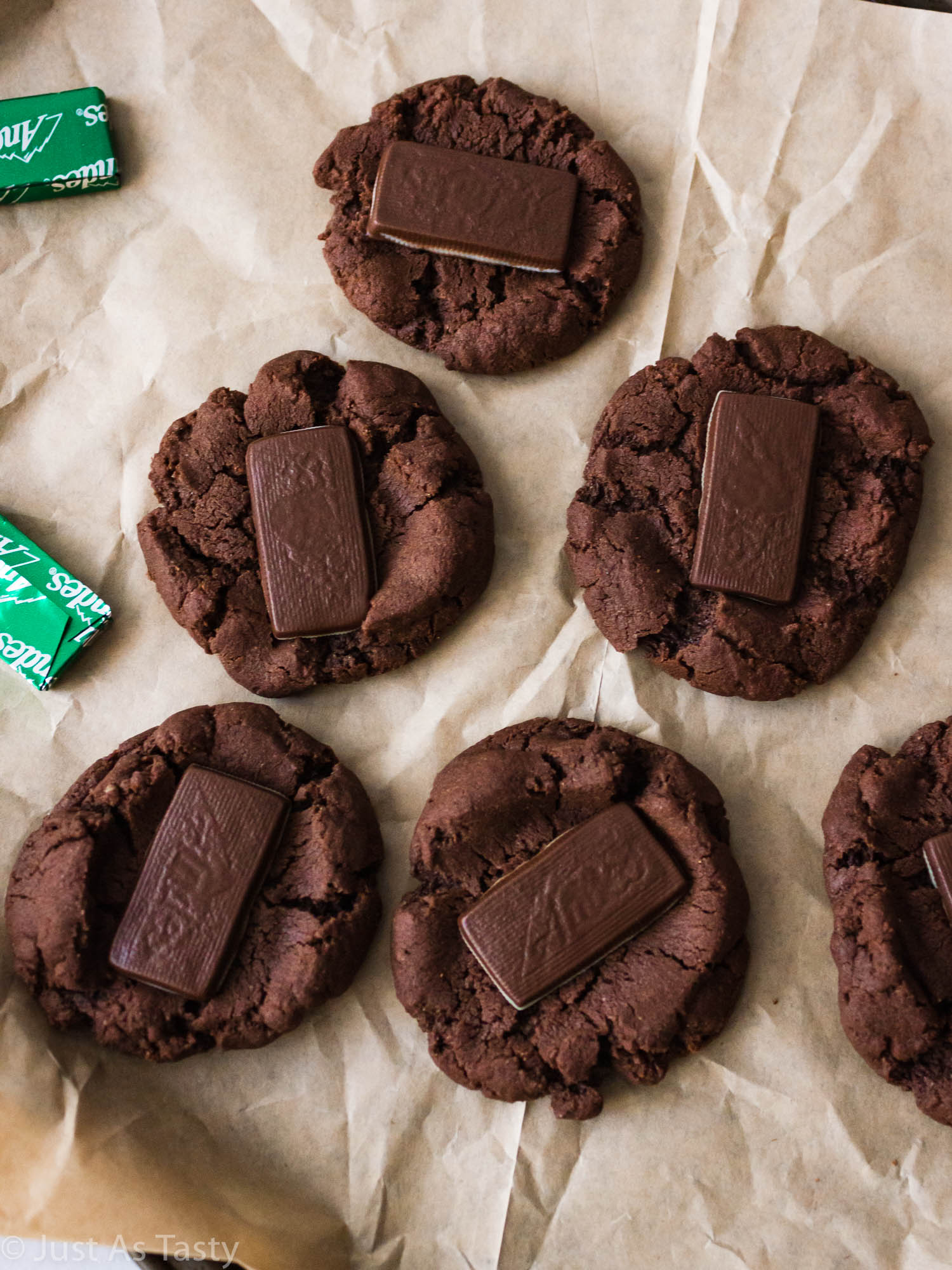 Andes mint chocolate cookies on brown parchment paper.