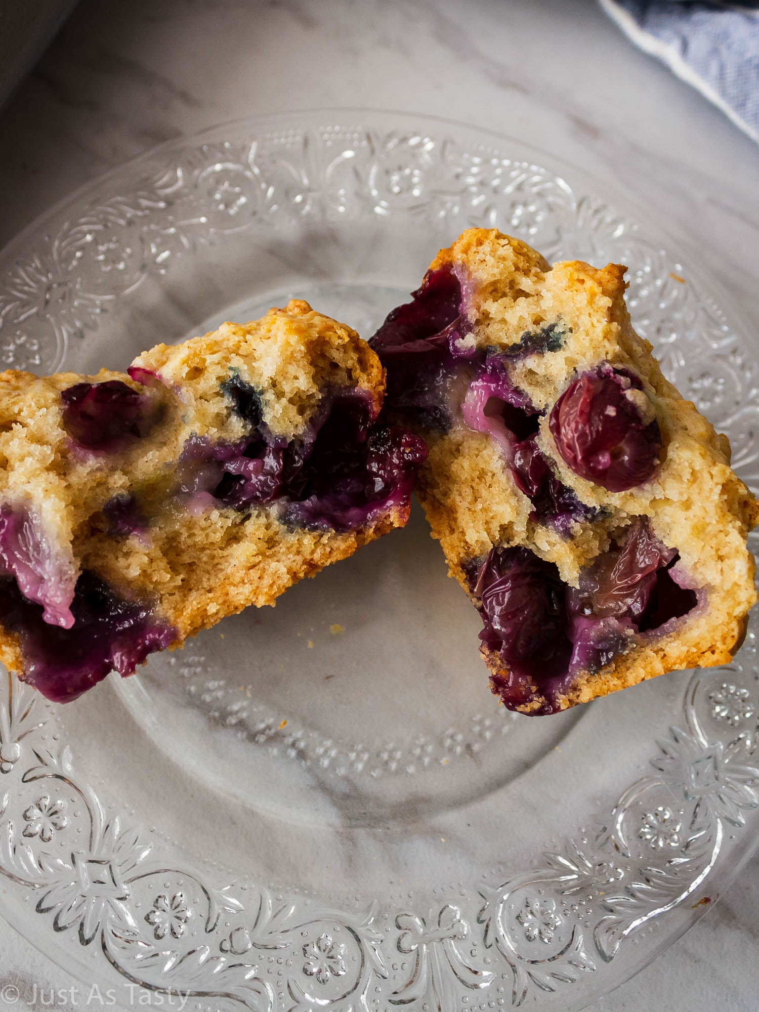 Close-up of a blueberry muffin cut in half.