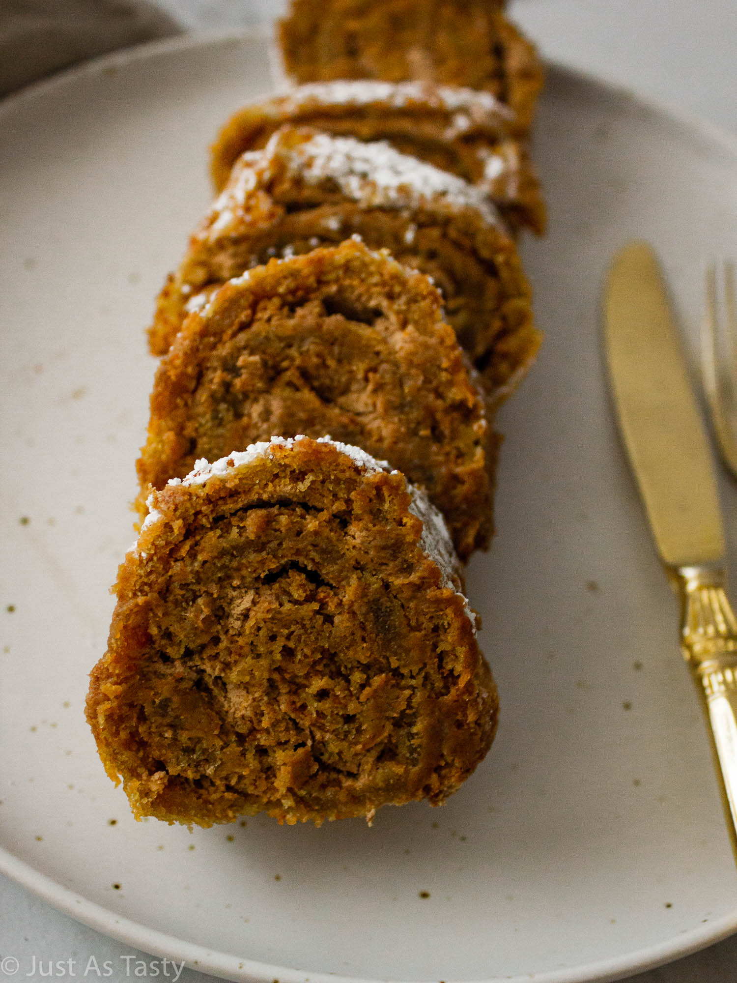 Round cake slices on a white plate.