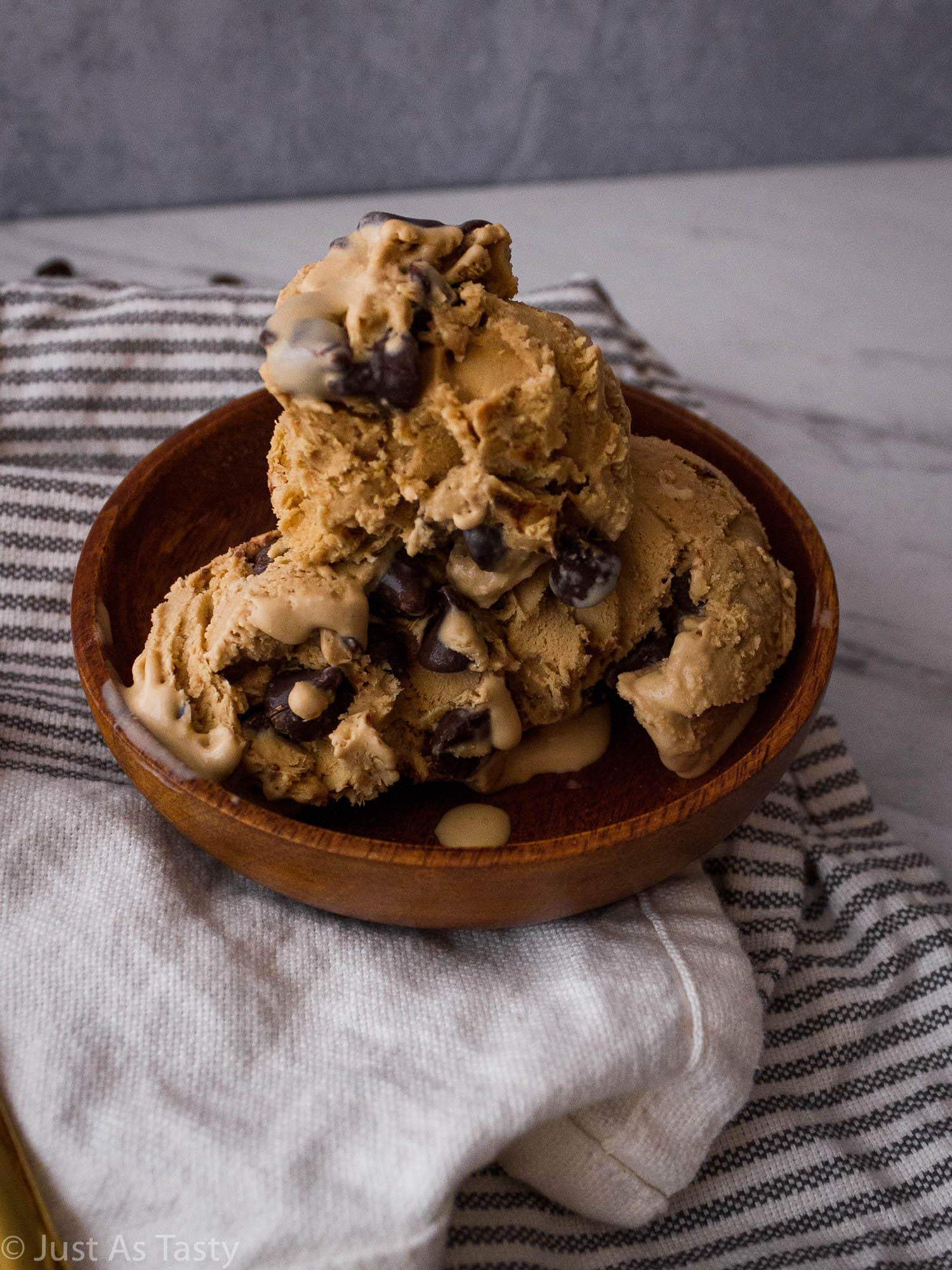 Scoops of no-churn coffee ice cream in a wooden bowl. 