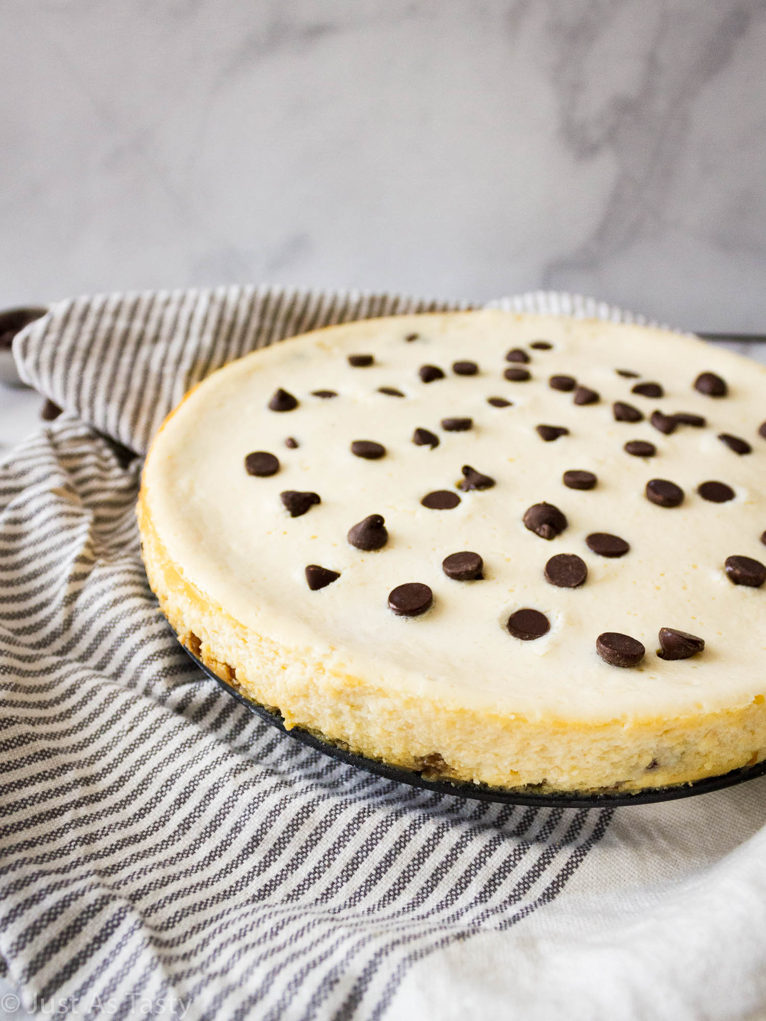 Cheesecake topped with chocolate chips.