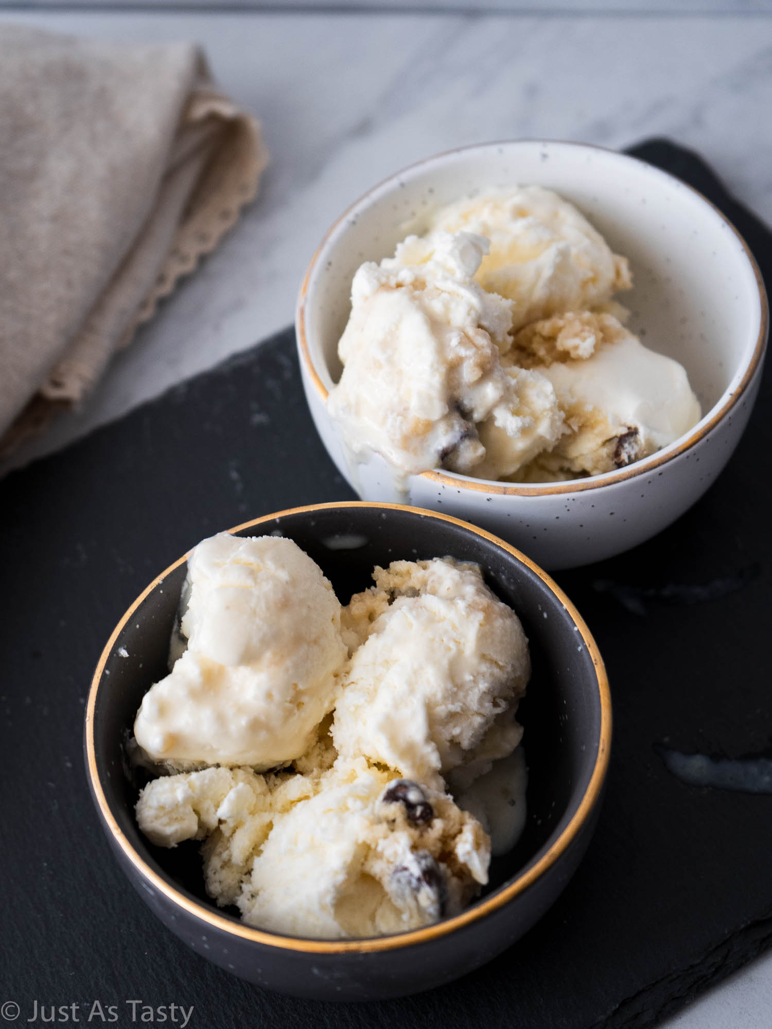 Two bowls of cookie dough ice cream. 