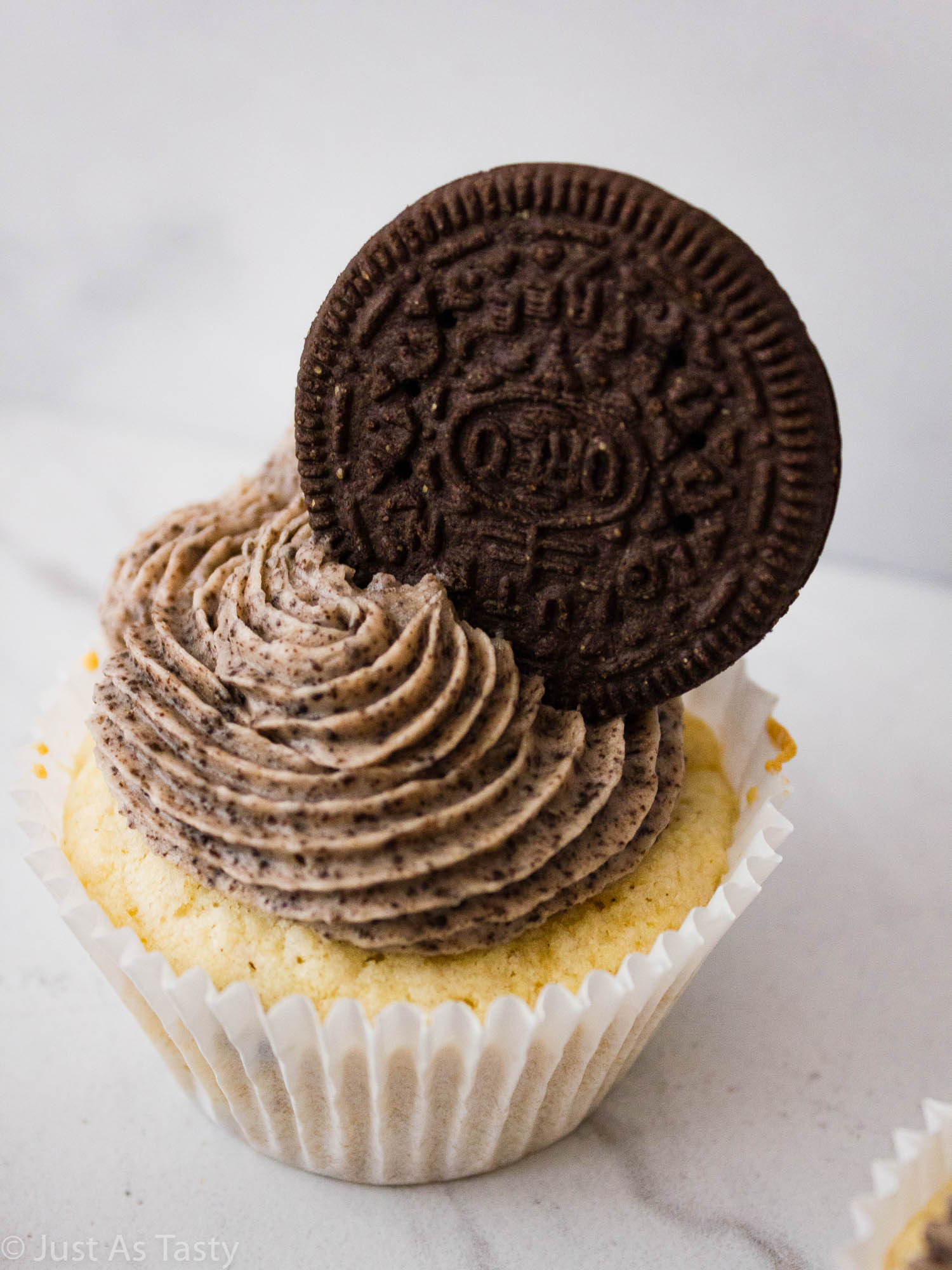Close-up of a frosted Oreo cupcake.