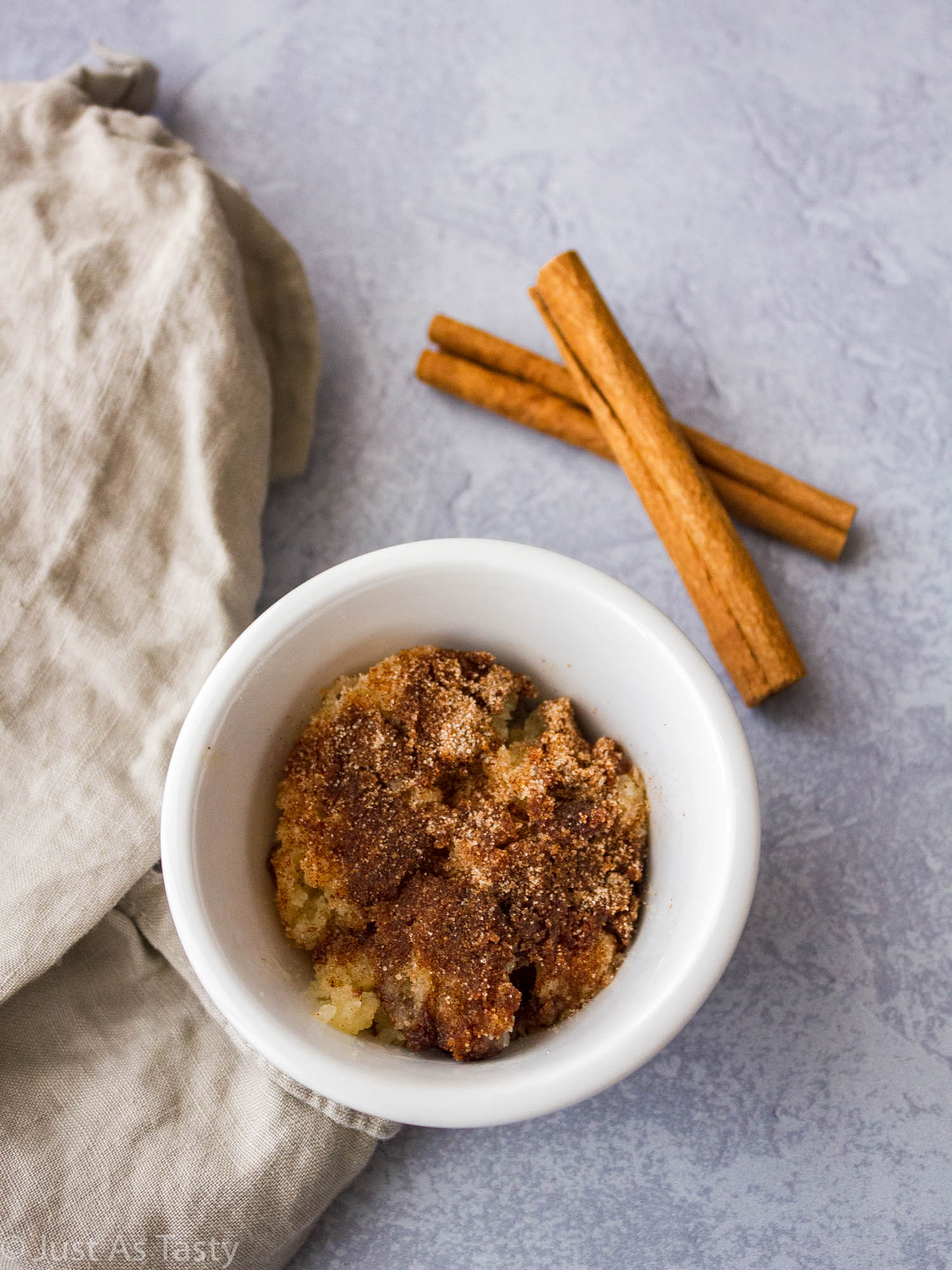 Snickerdoodle mug cake in a white mug. 