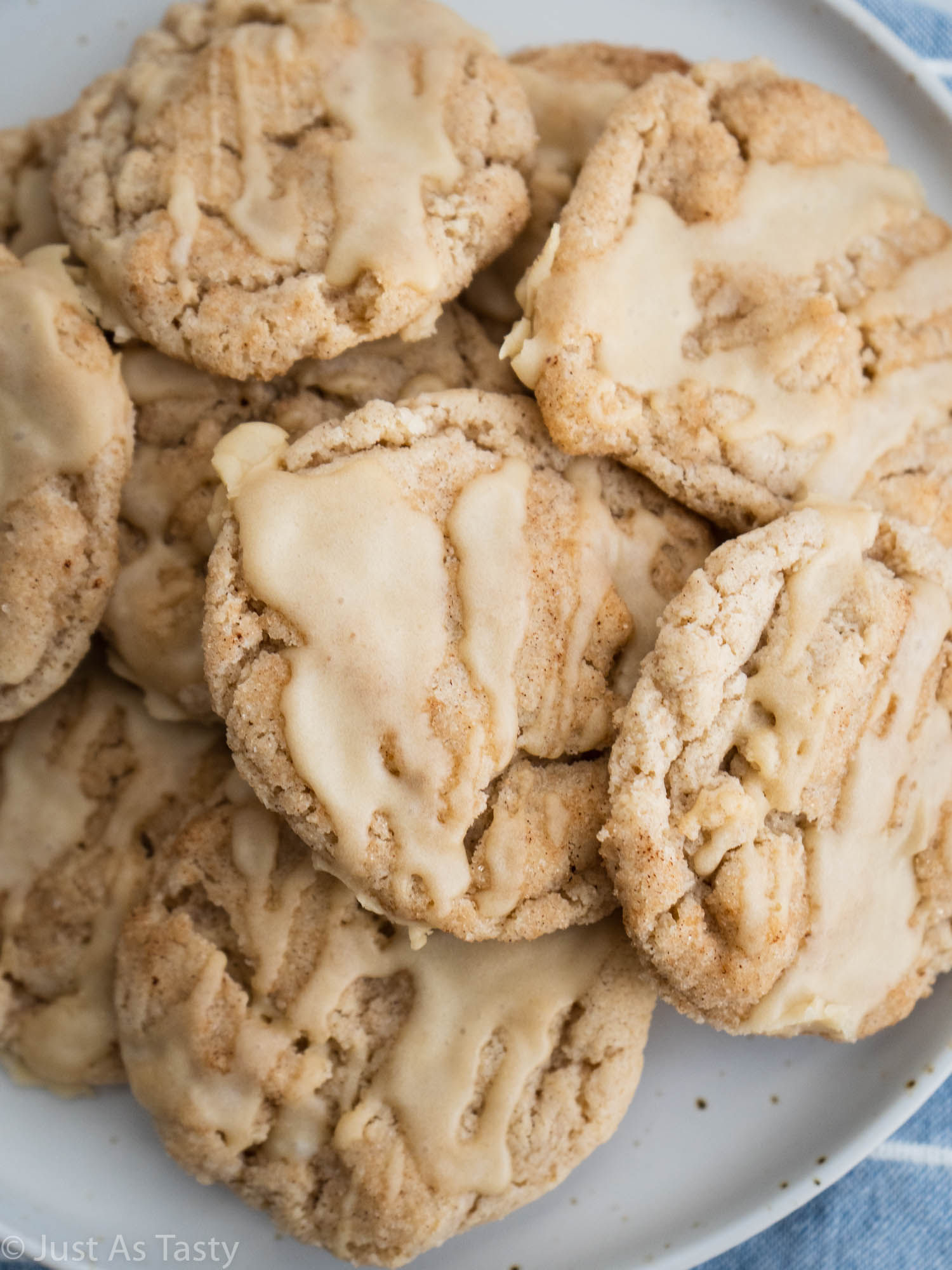 Glazed cookies piled on a plate. 